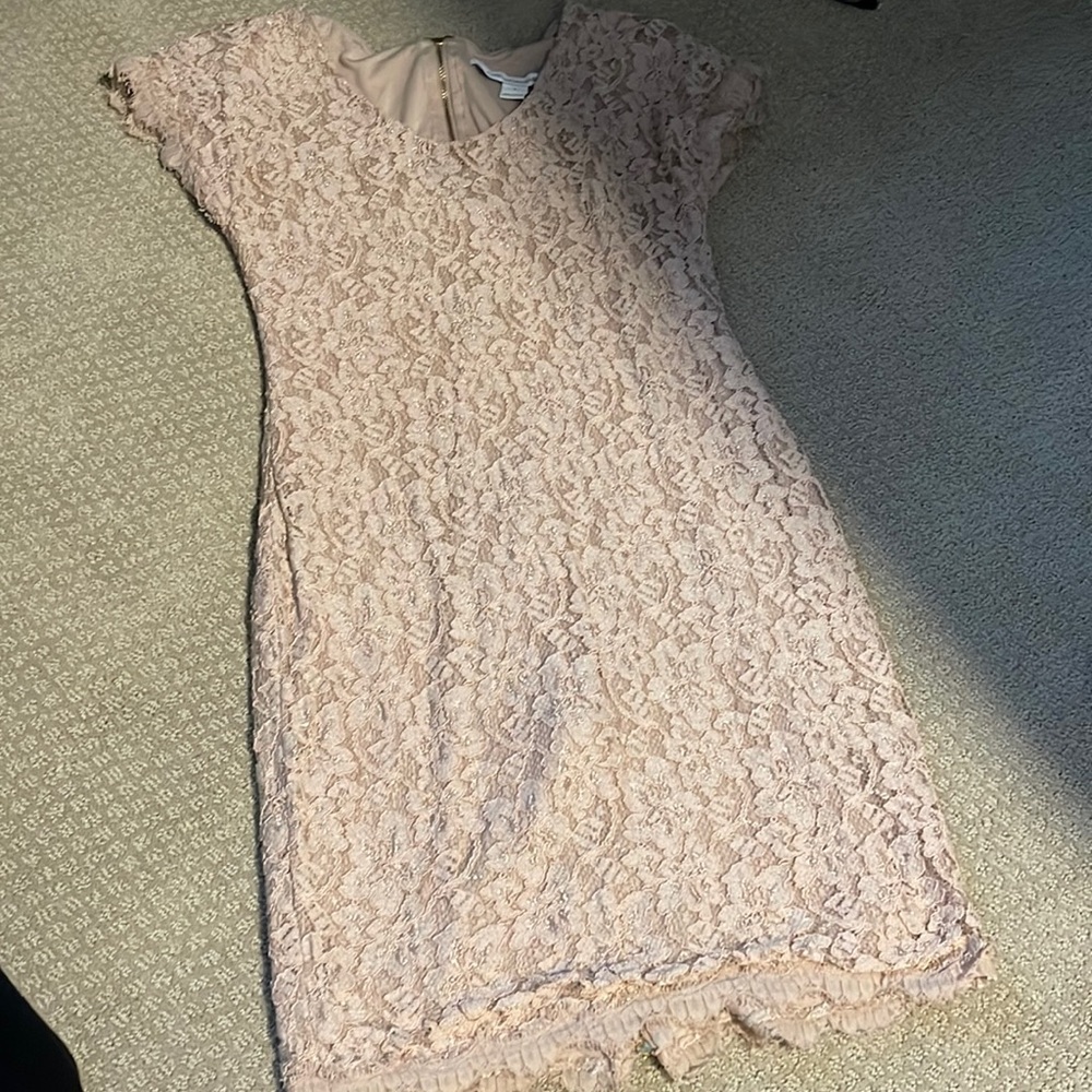 Diane Von Furstenberg Body hugging dress; looks even better on!!